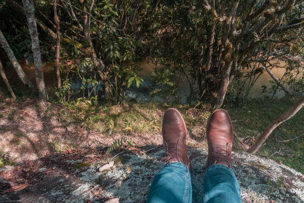 istock scene of man feet with blue pants 1141733359