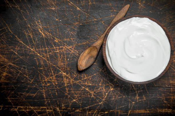 istock Fresh sour cream in bowl with spoon . 1141734277