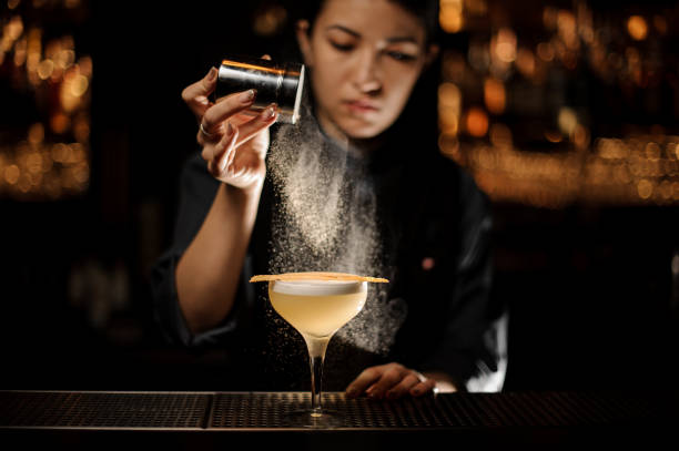 istock Bartender pours an alcohol cocktail in glass 1141734405