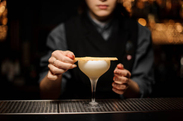 istock Bartender pours an alcohol cocktail in glass 1141734492