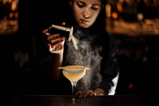 istock Bartender pours an alcohol cocktail in glass 1141734617