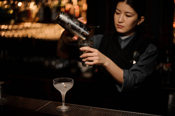 istock Bartender pours an alcohol cocktail in glass 1141734687