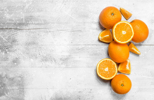 istock Whole and pieces of oranges. 1141734832