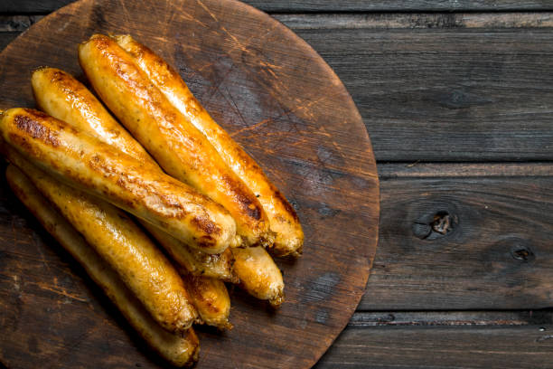 istock Grill beef sausages on a round Board. 1141735502