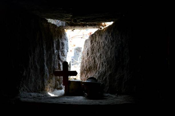 istock a small stone window and a cross 1141736024