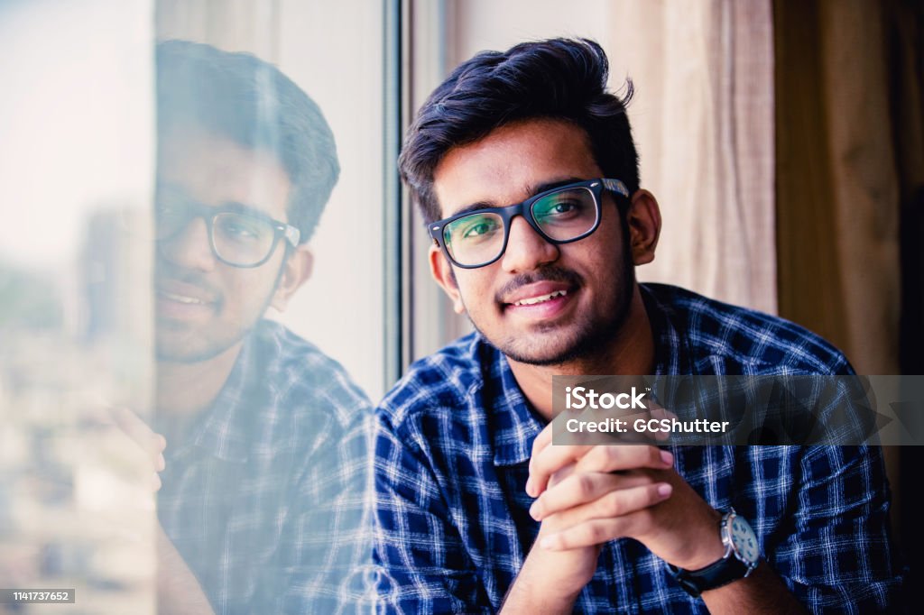Portrait of a Confident Young Man University Student, Portrait, Positivity, Aspirations - Young Lad Looking at the Camera for a Portrait India Stock Photo