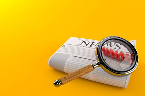 istock Newspaper with magnifying glass 1141741110