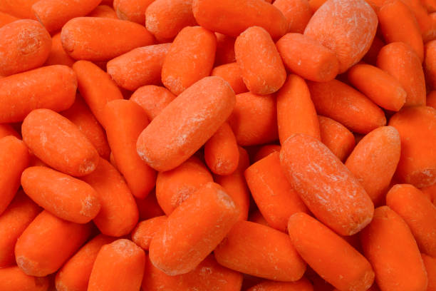 istock Little fresh carrots as a background. Snack. 1141744550