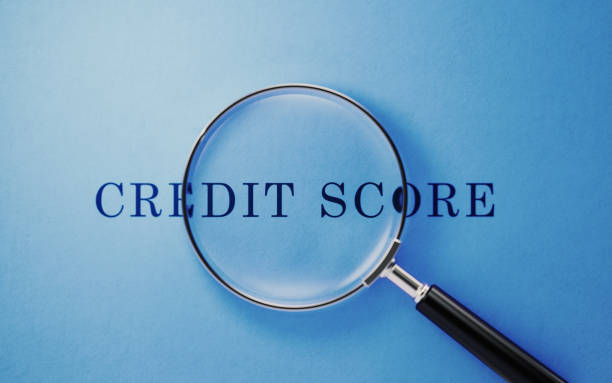 istock Credit Score Concept - Magnifier And Credit Score Text On Blue Background 1141747113