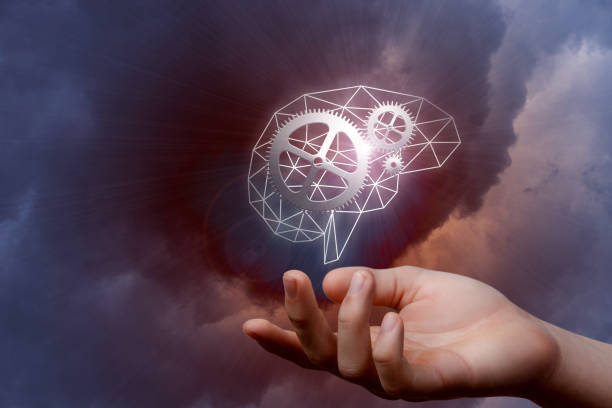 istock A digital brain model with gears inside hanging above a hand. 1141748321