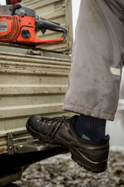 istock A worker stepping up on a stair. 1141748360