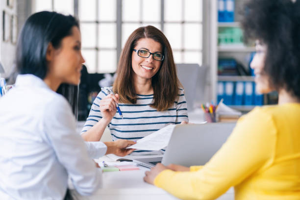 istock Female manager discussing business in creative office 1141748391