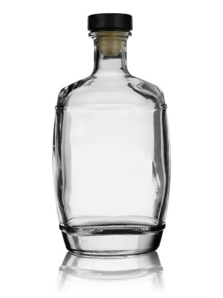 istock Empty glass bottle with a thick bottom closed by a cover with reflection. Isolated on a white background 1141748639