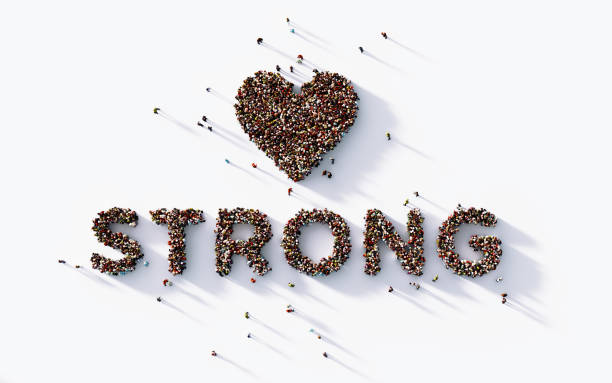 istock Human Crowd Forming A Heart Shape And Strong Text: Bonding And Social Media Concept 1141749570