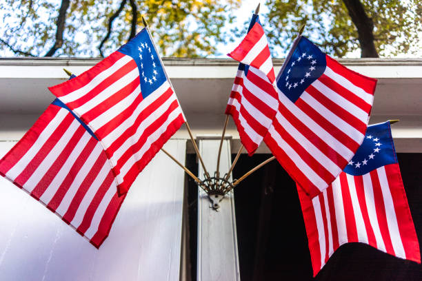 istock Old American flags with a ring on the building 1141750176