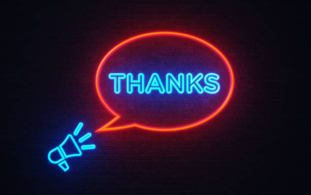 Megaphone Icon And Thanks Shaped Neon Light On Black Wall