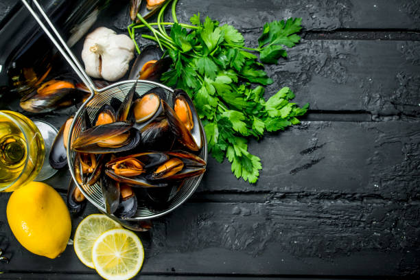 istock Fresh seafood clams with white wine and parsley. 1141753638