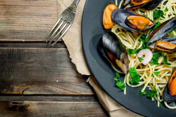 istock Mediterranean pasta. Seafood spaghetti with clams and lime. 1141754467