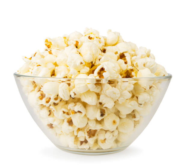 istock Popcorn in a glass plate on a white, close-up. isolated. 1141755173
