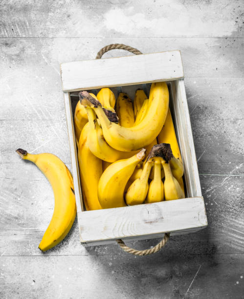 Fresh bananas in a wooden box.