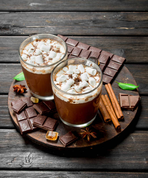 istock Hot chocolate in mugs with marshmallows and fragrant cinnamon. 1141758199