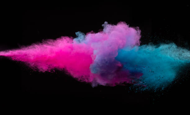 istock Collision of two colored powders isolated on black 1141758385