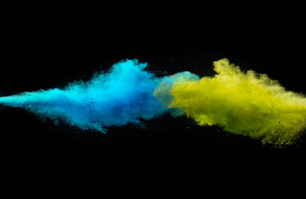 istock Collision of two colored powders isolated on black 1141758392