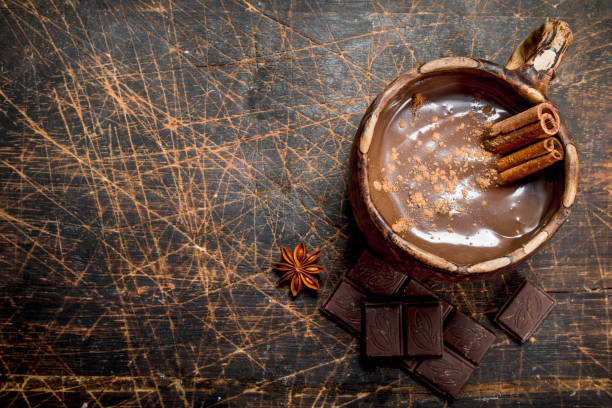 istock Cup of hot chocolate with cinnamon sticks. 1141759332