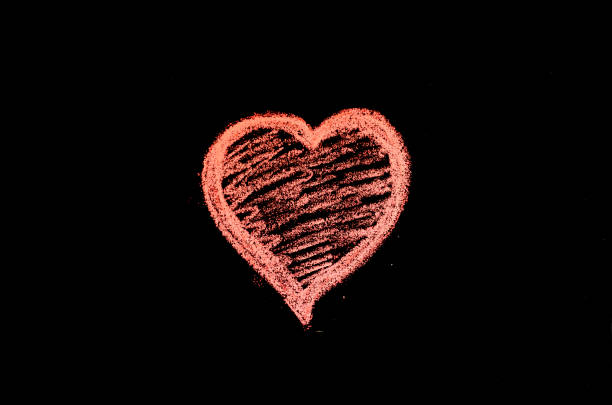 istock hand drawn heart on chalk board 1141759439