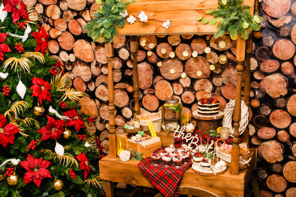 istock Christmas tree near a table with sweets in new year decoration 1141759751