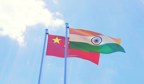istock China and India, two flags waving against blue sky 1141759874