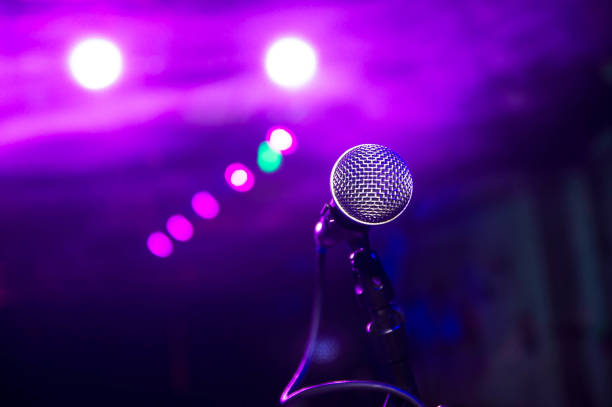 istock the microphone under the stage lights with bokeh 1141760022