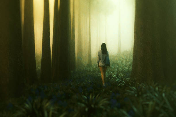 istock Young woman walking in mysterious forest at night 1141761140