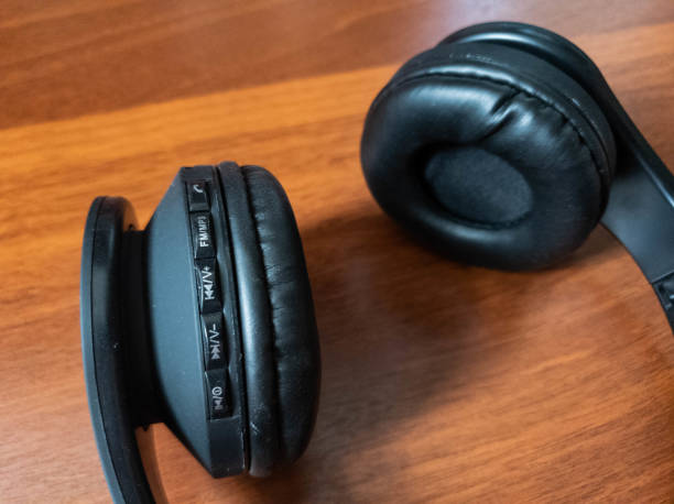 istock The Wireless bluetooth headphones in black close-up 1141761605