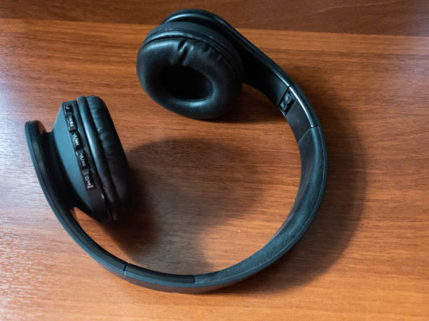 istock The Wireless bluetooth headphones in black close-up 1141761642