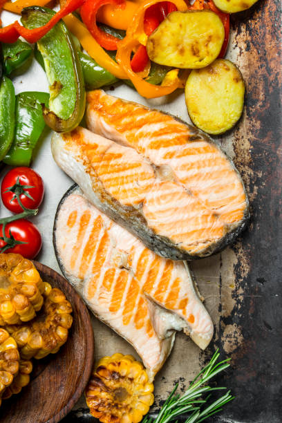istock Grilled salmon steaks with vegetables. 1141763069