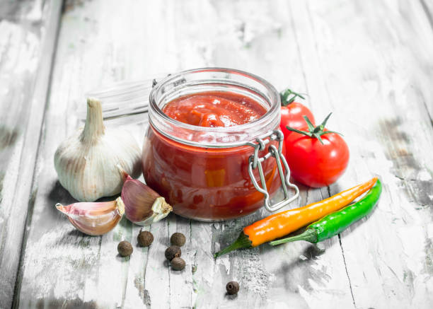 istock Tomato sauce in a jar and spices. 1141763591