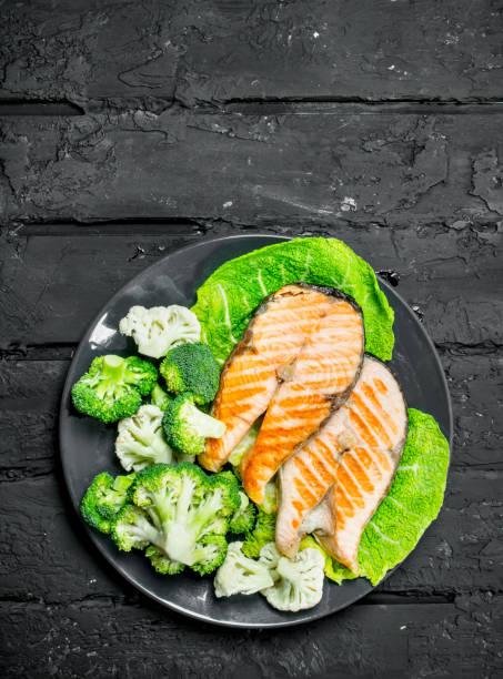 istock Grilled salmon steaks with fresh broccoli in a plate. 1141763607