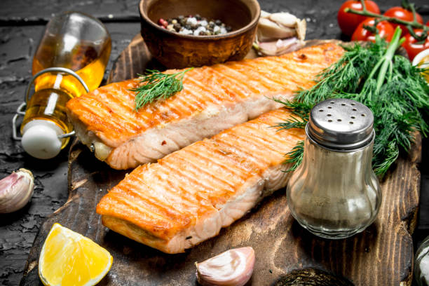 istock Grilled salmon fillet with spices and dill branches. 1141763622