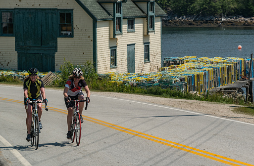 Northwest Cove, Canada - Two friends happily ride route 329 around Nova Scotia's Aspotogan peninsula.