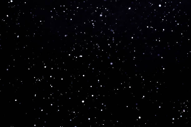 istock Falling snow on black background Snowflakes Flying in the air. 1141765281
