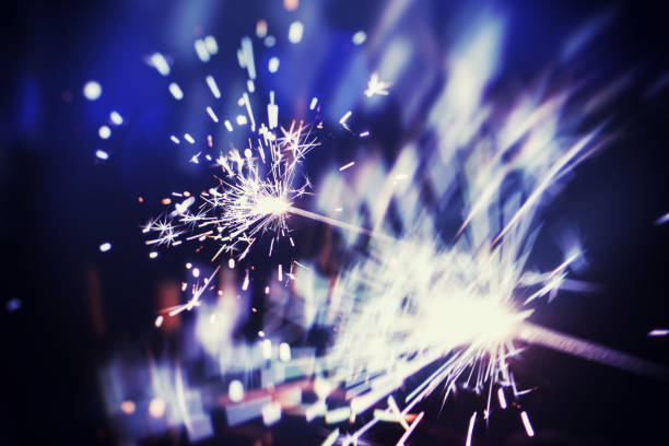 istock christmas sparkler glowing in the dark 1141766714
