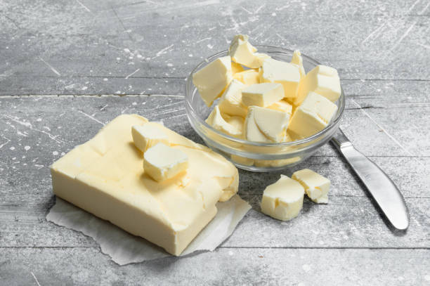 istock Butter in a glass bowl with a knife. 1141767524