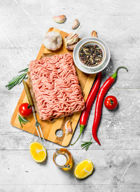 istock Raw minced beef with hot chili peppers and spices . 1141767554