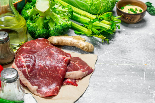Organic food. Raw beef meat with healthy food.