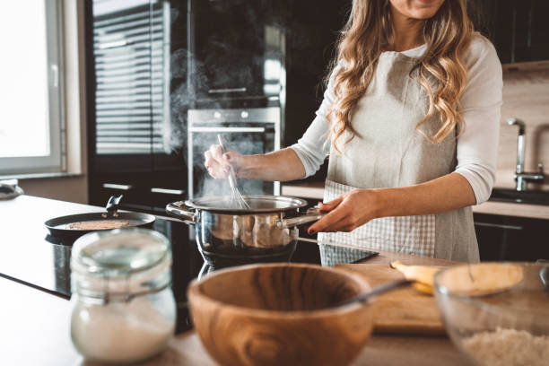 istock A woman making soup in a modern kitchen 1141770961
