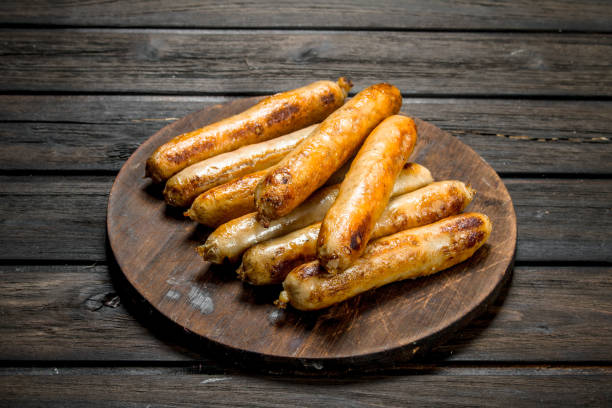 istock Grill beef sausages on a round Board. 1141771017