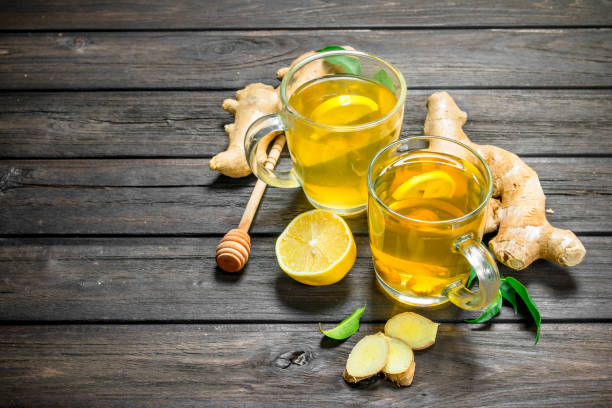 istock Ginger tea and lemons with leaves. 1141771134