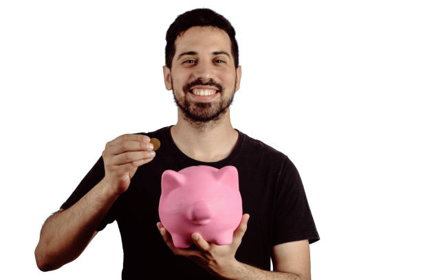 istock Young man with piggy bank 1141771727