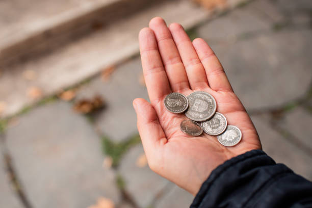 swiss francs in the hands of a man. swiss francs coins. finance and money concept. travel to switzerland - swiss francs swiss currency switzerland finance imagens e fotografias de stock